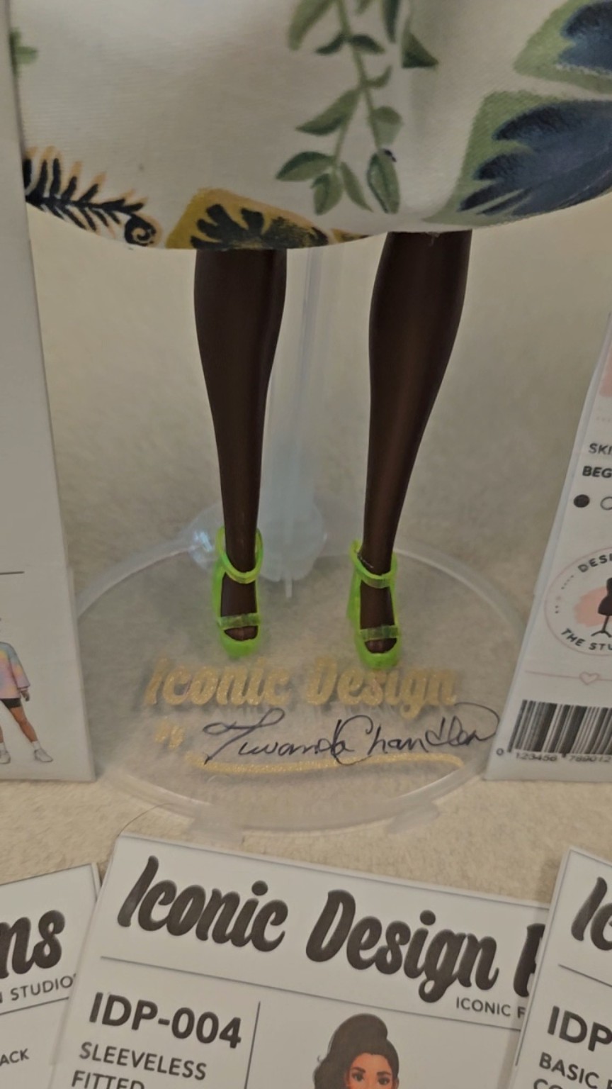 Close-up of the custom Iconic Design doll stand with Tuwanda Chandler signature