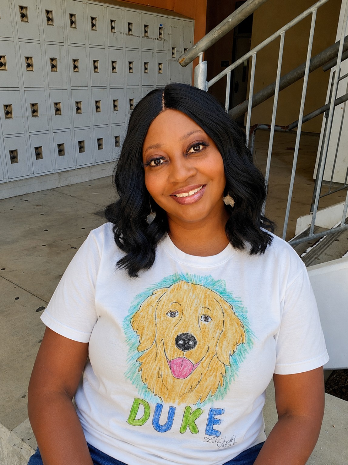 Tuwanda wearing the Duke pet portrait T-shirt.